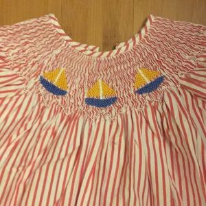 Sail away in this beautiful Smocked Sailboat dress